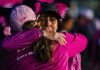 two woman hugging at a susan g komen 3 day